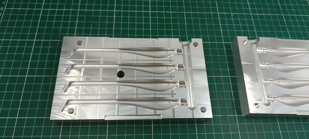 Four cavity CNC machined aluminum mold for 5" twitching shad lure production